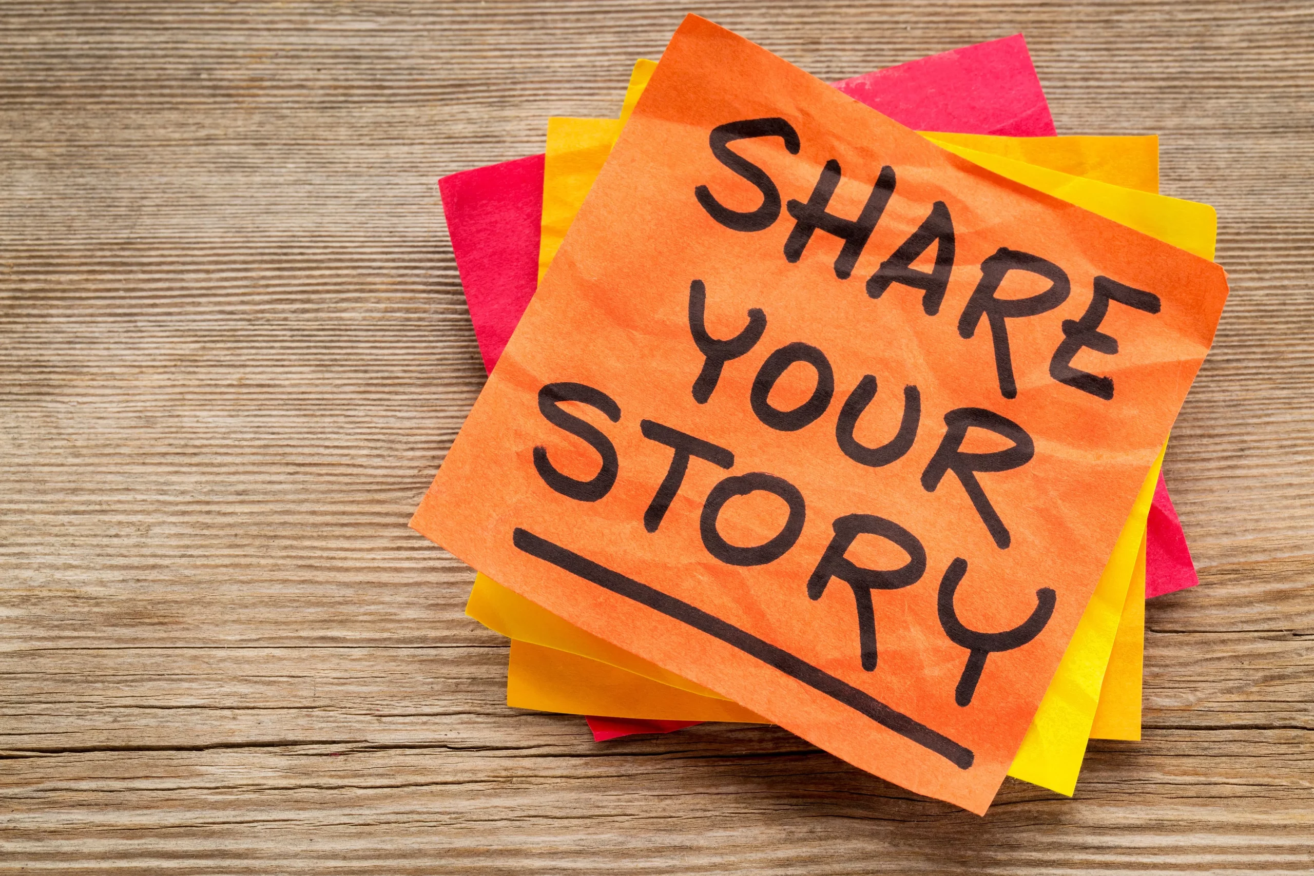 Post-it orange "Share your story"